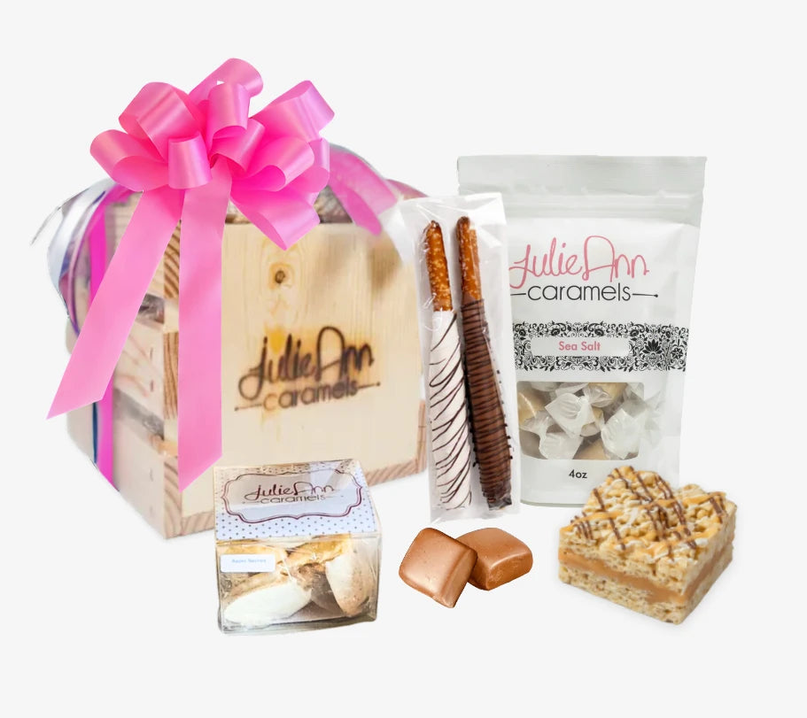A gift crate tied with a pink ribbon